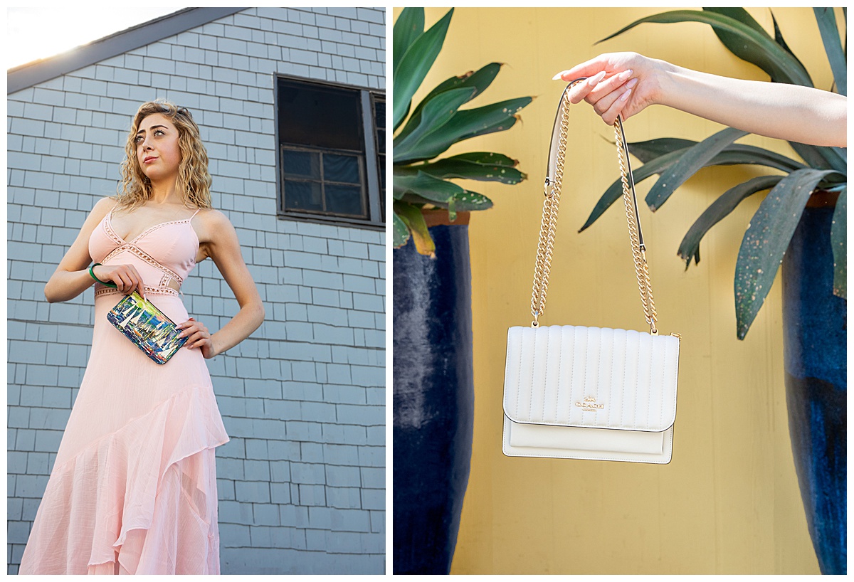 Woman with curly blonde hair wearing a pink dress poses in front of a blue wall and a yellow wall showing off Coach purses in a fashion photoshoot.