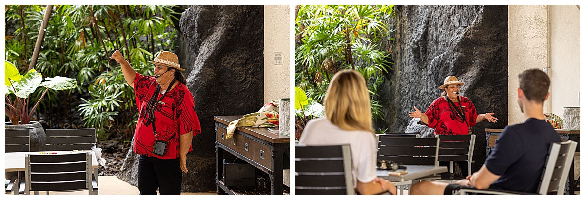 A lei making cultural activity at the Outrigger Kona Resort & Spa. The teacher wears a red and black shirt and brown wicker hat. She is smiling as she describes the activity.