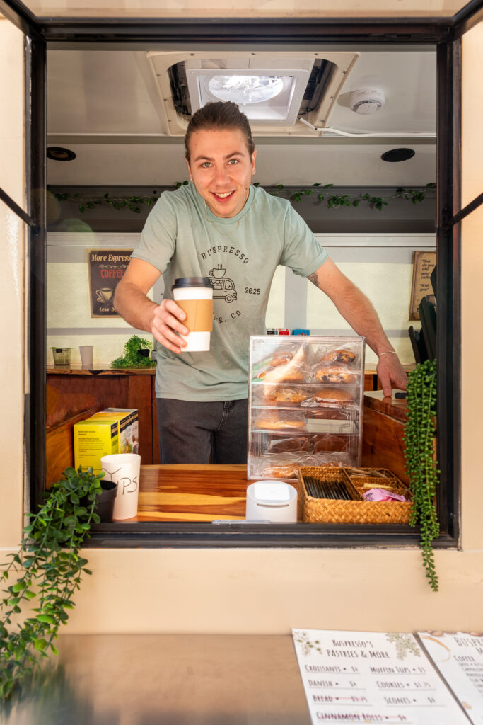 River Low interacting with customers at Buspresso Denver mobile espresso bar