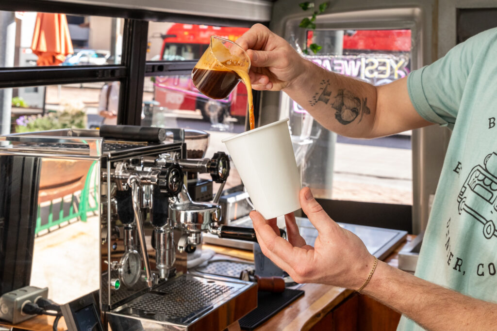 Buspresso mobile barista preparing coffee in Denver food truck