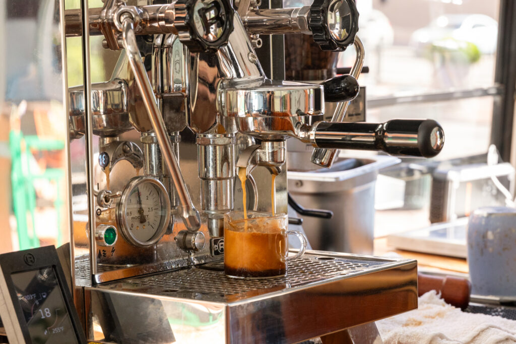 Buspresso coffee cups branded with Denver local logos